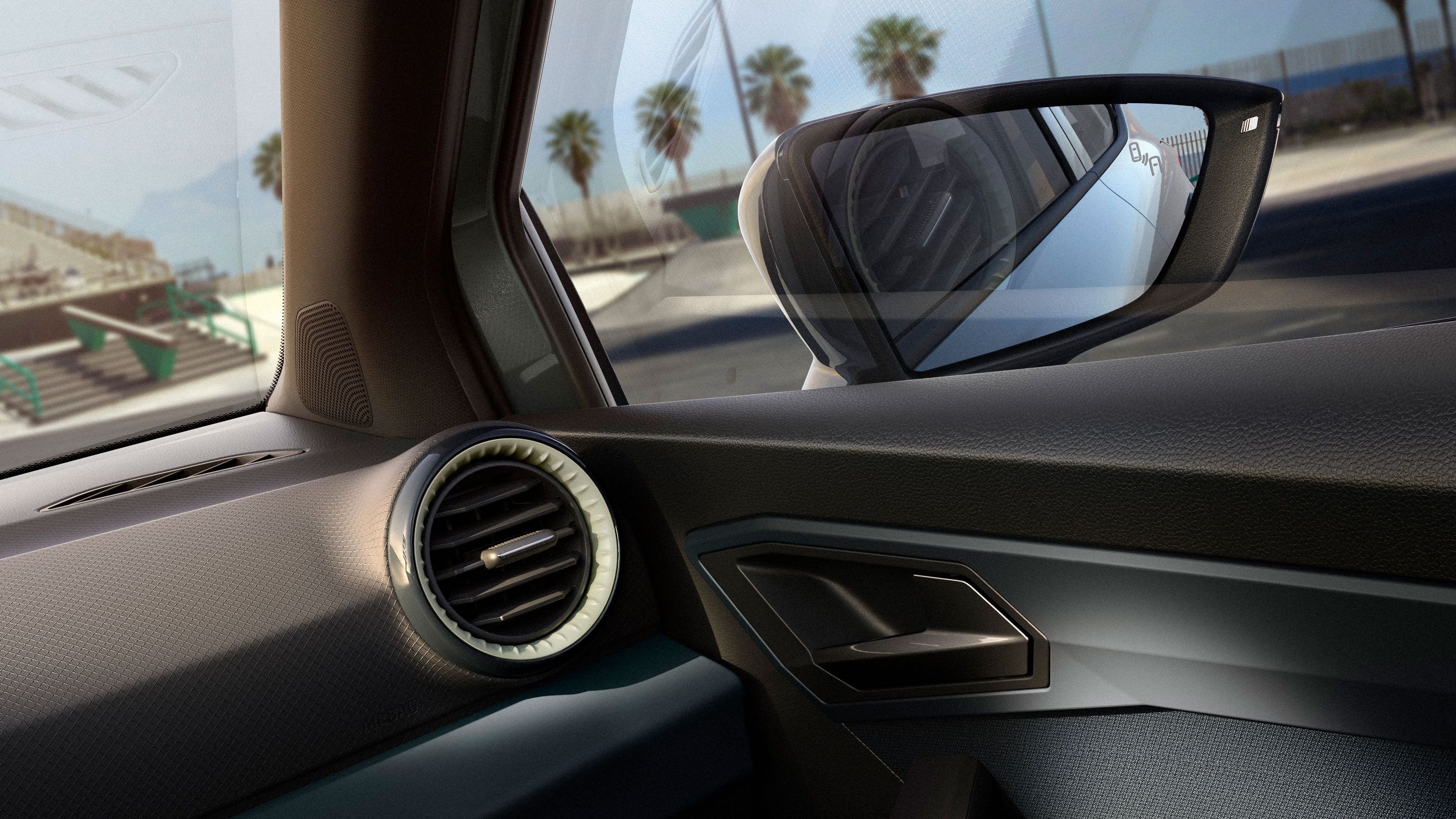 Teilansicht des Innenraums eines SEAT Arona mit einigen Details und dem rechten Außenspiegel